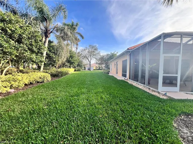 a backyard of a house with lots of green space