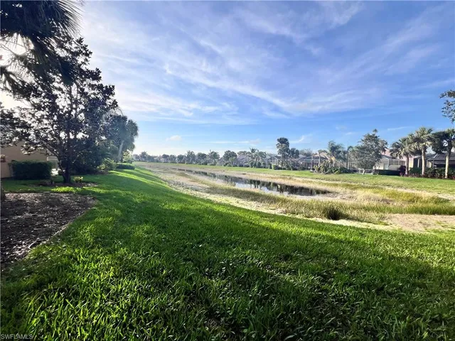 a view of a lake with a big yard
