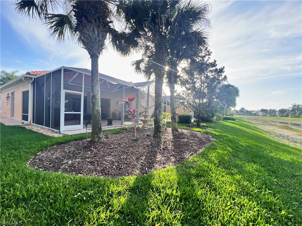7651 Hernando Court Naples, FL 34114 - Photo 35 of 37 a view of a backyard with large trees
