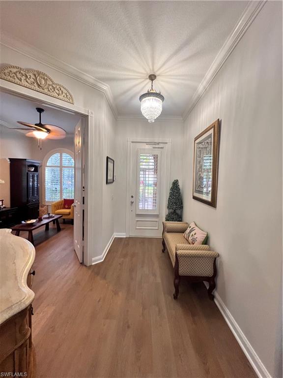 7651 Hernando Court Naples, FL 34114 - Photo 5 of 37 a living room with furniture a flat screen tv and a window