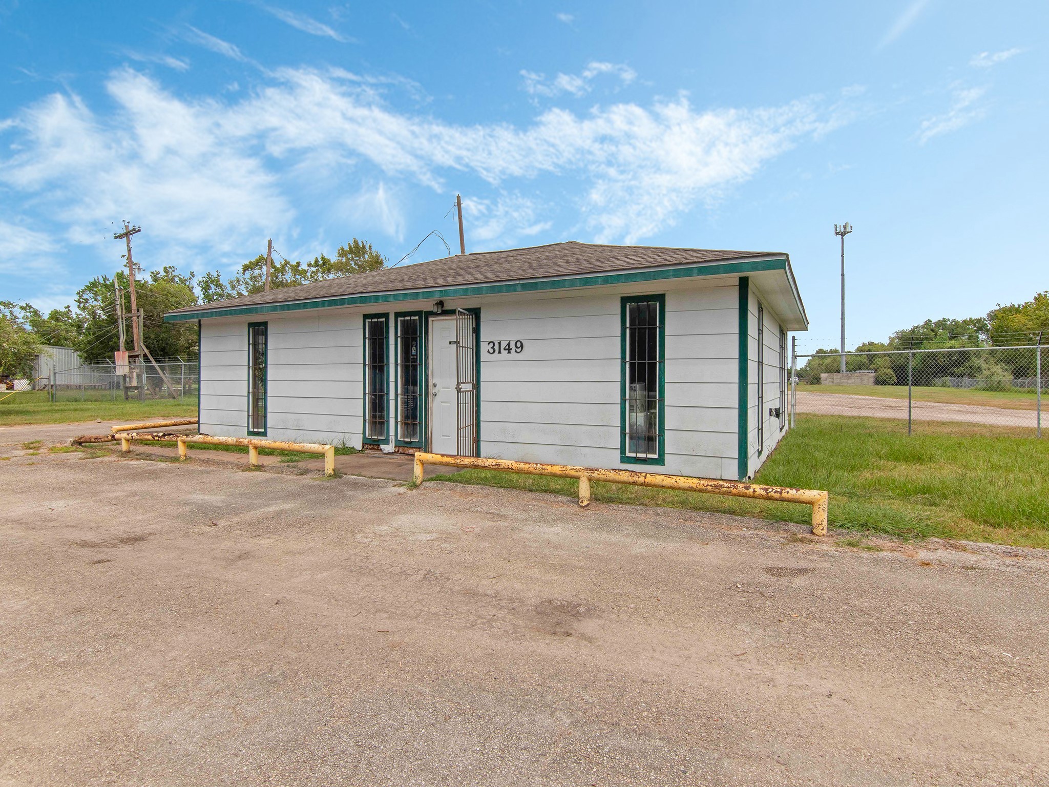 3149 Harkey Road Pearland, TX 77584 - Photo 4 of 14 front view of a house with a yard