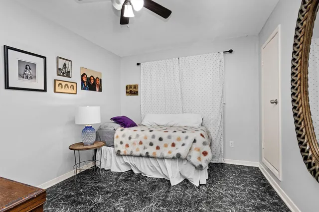 a bedroom with a bed and cabinets