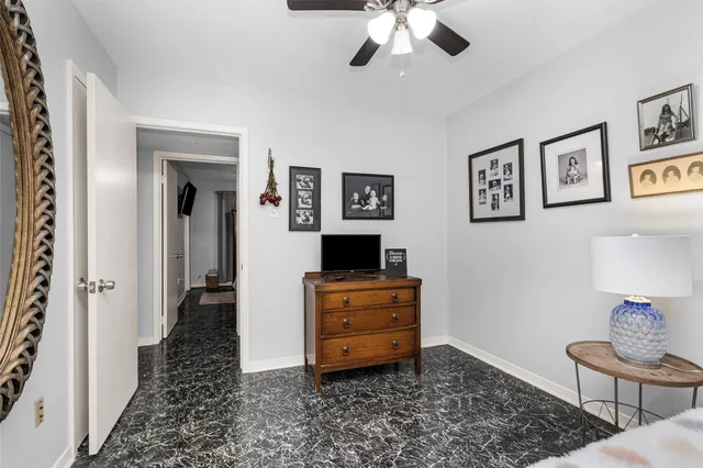 a room with painting on the wall and table