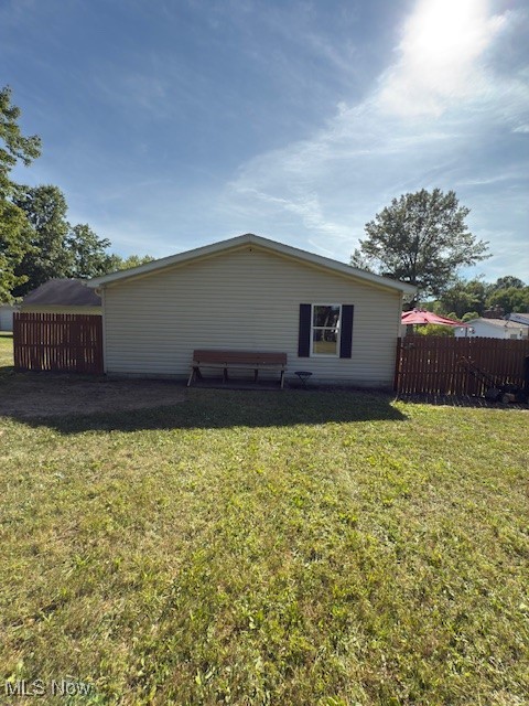 3868 Cook Road Rootstown, OH 44272 - Photo 38 of 44 View of back of home including a bench that stays with the property.