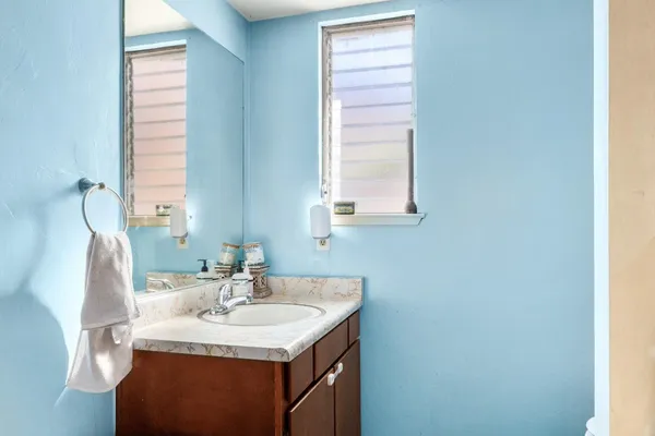 a bathroom with a sink and a mirror