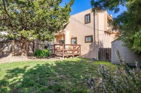 a view of a house with backyard