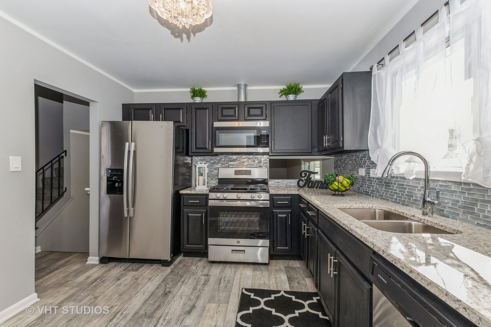 130 Oriole Road Matteson, IL 60443 - Photo 6 of 19 a kitchen with stainless steel appliances granite countertop a sink stove and refrigerator
