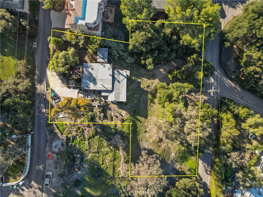 23671 Aster Trail Calabasas, CA 91302 - Photo 3 of 15 a aerial view of a house with a yard and garden