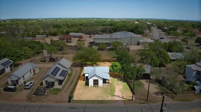 an aerial view of a house with a garden