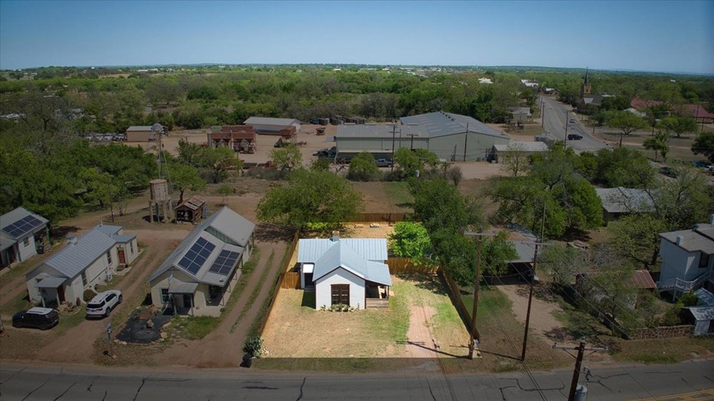 109 North Live Oak Street Mason, TX 76856 - Photo 20 of 22 an aerial view of a house with a garden