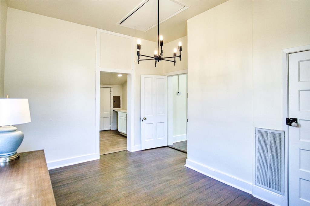 109 North Live Oak Street Mason, TX 76856 - Photo 10 of 22 a view of a room with wooden floor and a ceiling fan