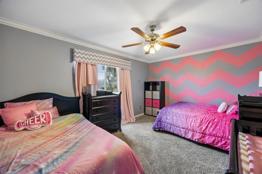 545 Rothschild Lane Murphy, TX 75094 - Photo 18 of 27 Spacious bedroom downstairs large enough for two double-sized beds and more.