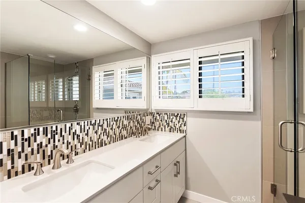 a bathroom with a bathtub and a sink