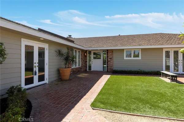 a view of a backyard with sitting area