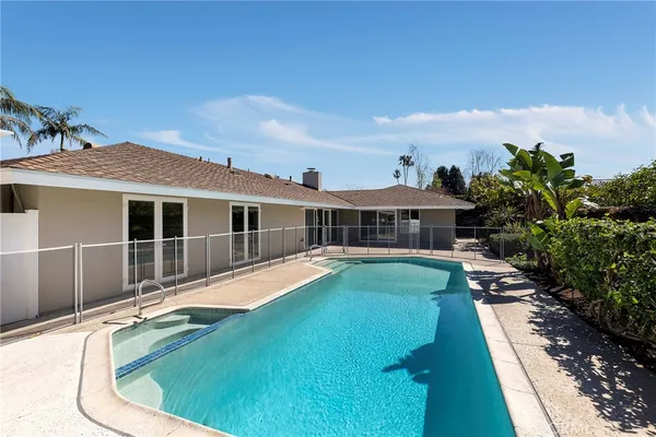 a house view with a swimming pool