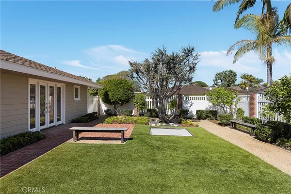a house with palm tree in front of it