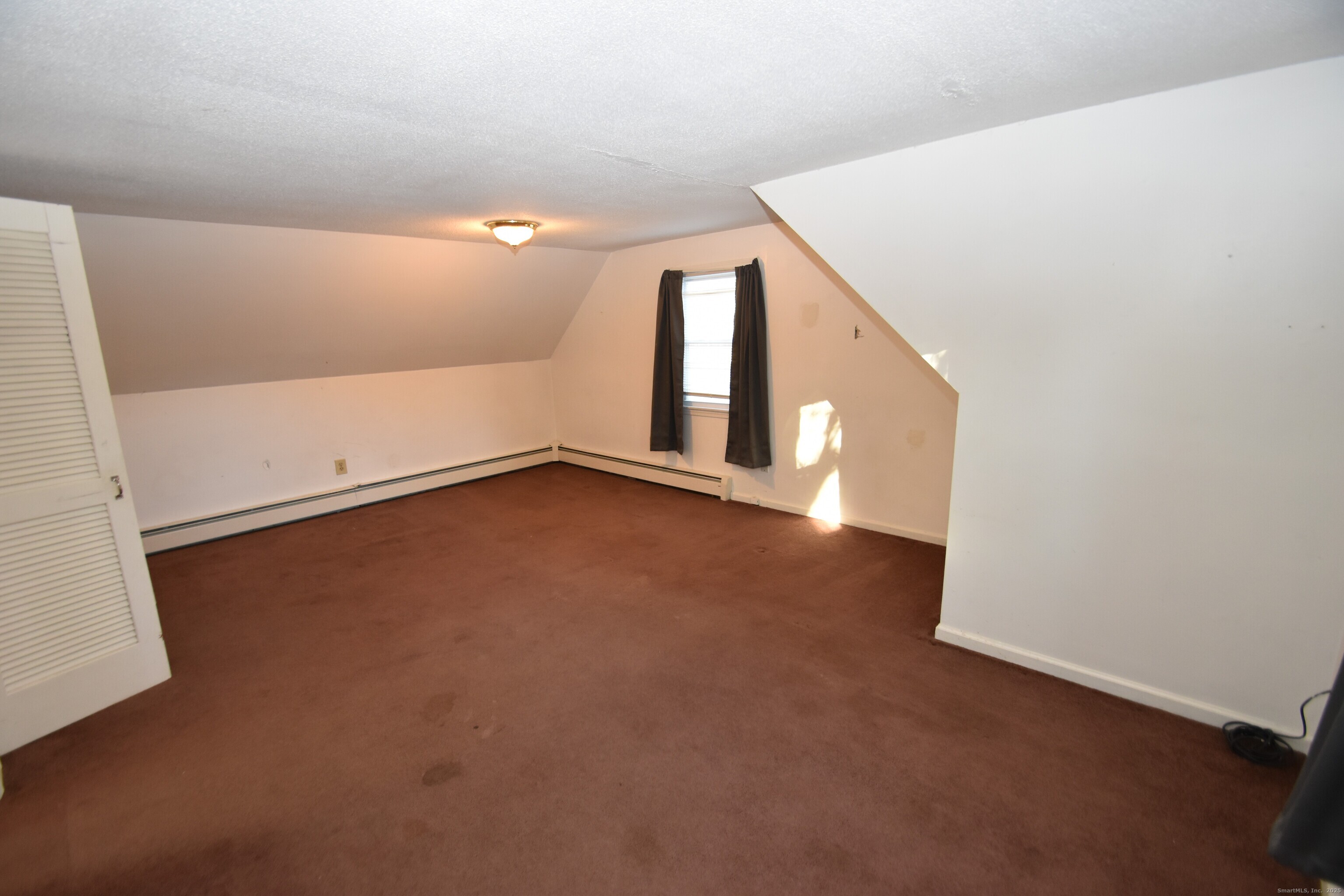 28 Hickory Road Colchester, CT 06415 - Photo 16 of 22 a view of an empty room with windows