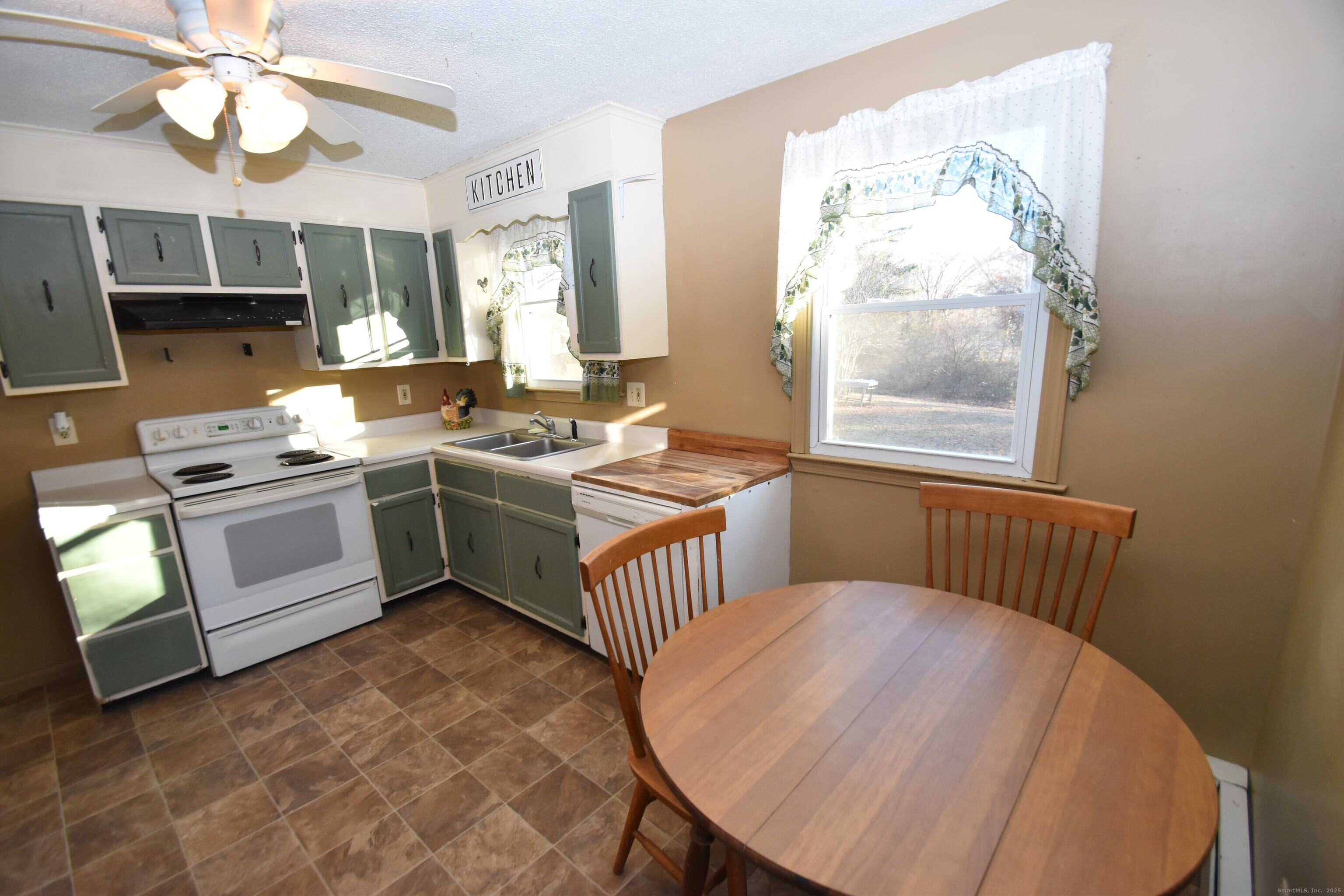 28 Hickory Road Colchester, CT 06415 - Photo 6 of 22 a kitchen that has a lot of windows in it