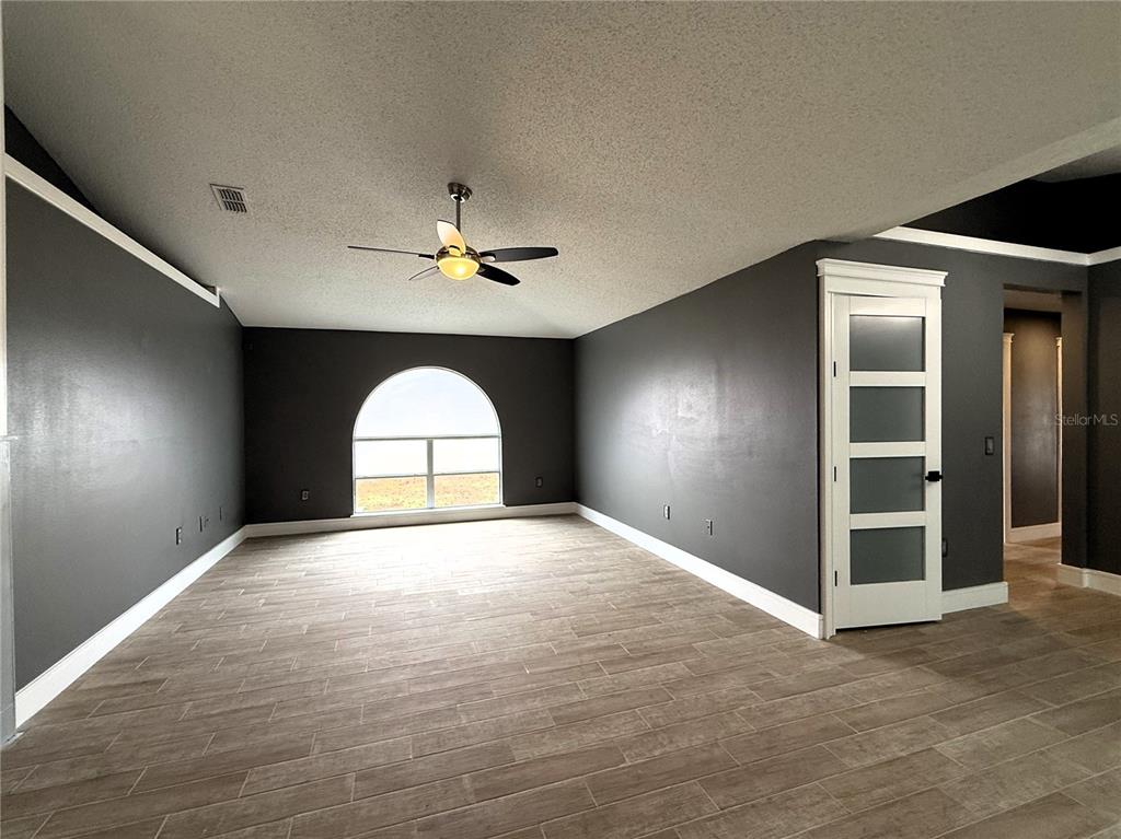 6172 Raleigh Street Spring Hill, FL 34606 - Photo 15 of 64 a view of empty room with a window