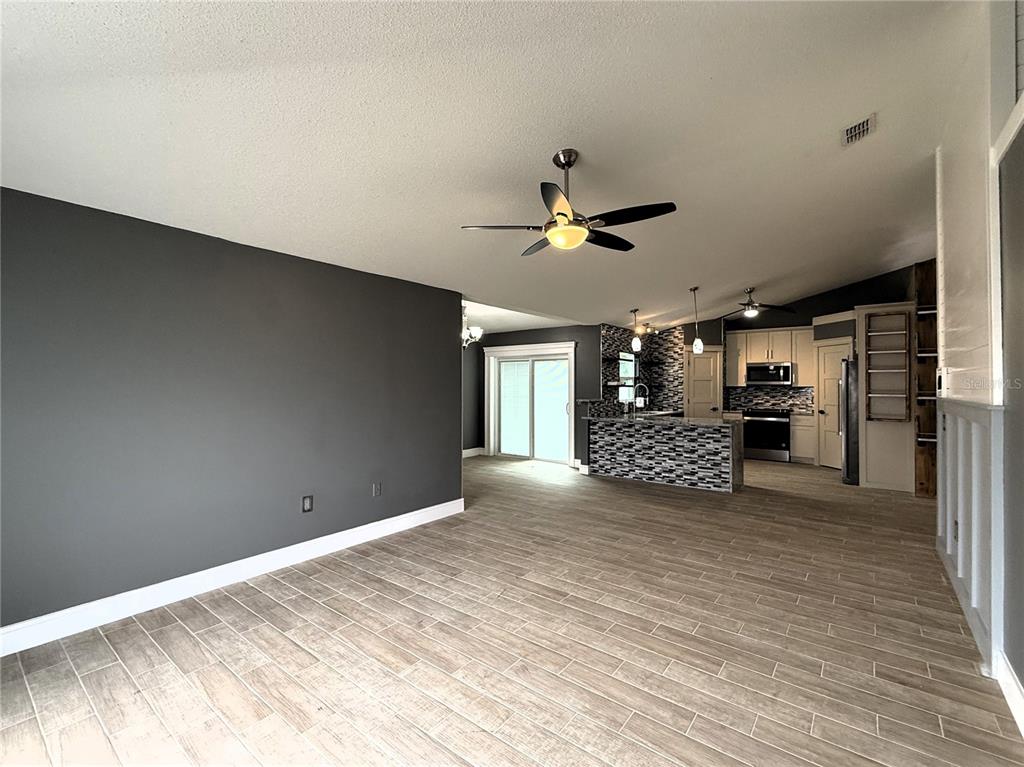 6172 Raleigh Street Spring Hill, FL 34606 - Photo 18 of 64 a view of a livingroom with a kitchen