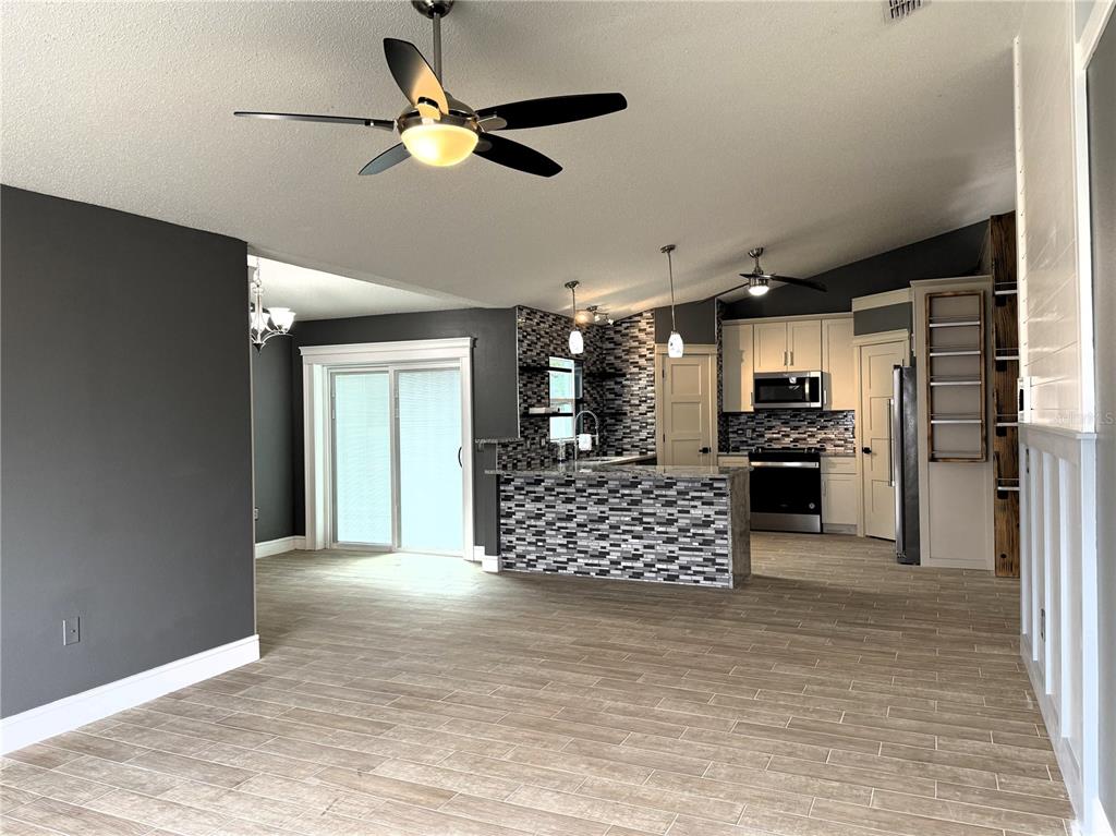 6172 Raleigh Street Spring Hill, FL 34606 - Photo 19 of 64 a view of kitchen with furniture and refrigerator