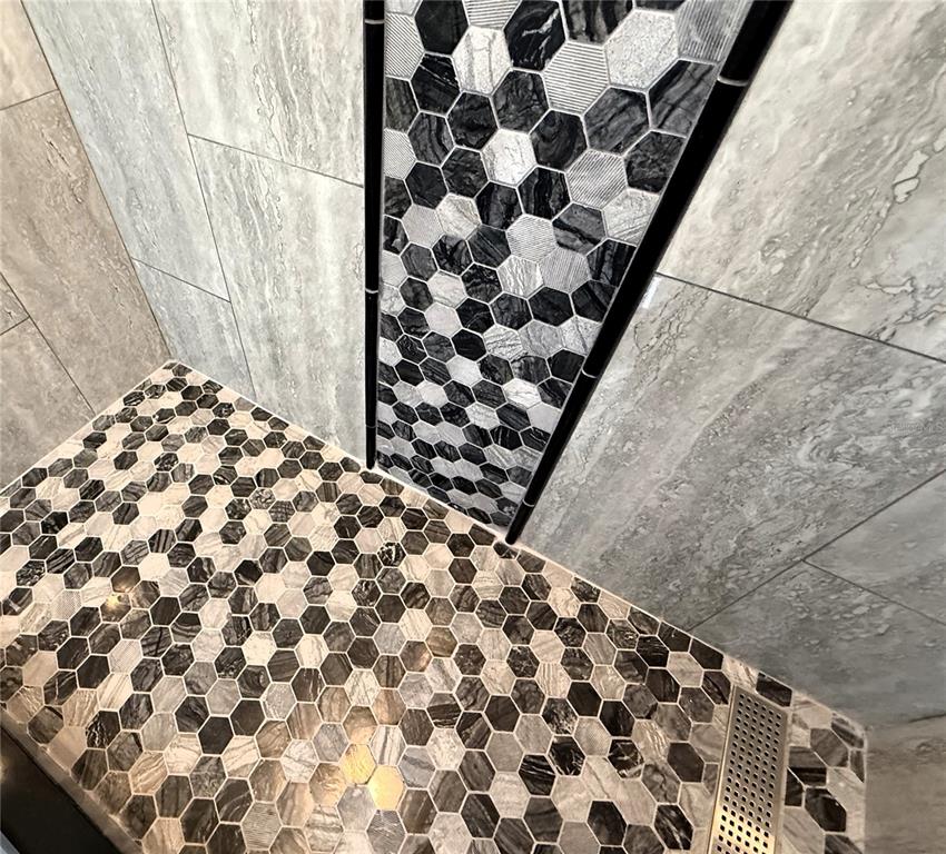 6172 Raleigh Street Spring Hill, FL 34606 - Photo 43 of 64 a bathroom with a bathtub and shower