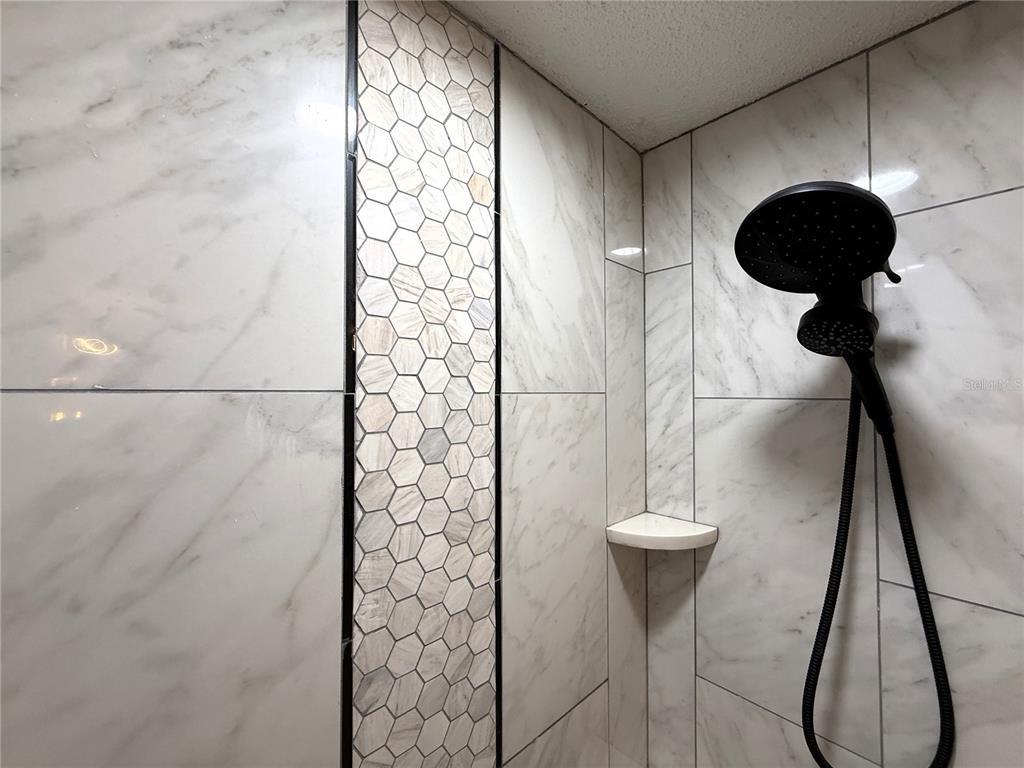 6172 Raleigh Street Spring Hill, FL 34606 - Photo 56 of 64 a bathroom with a shower