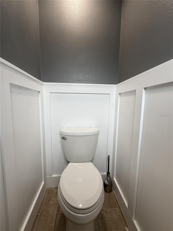 6172 Raleigh Street Spring Hill, FL 34606 - Photo 58 of 64 a bathroom with a toilet
