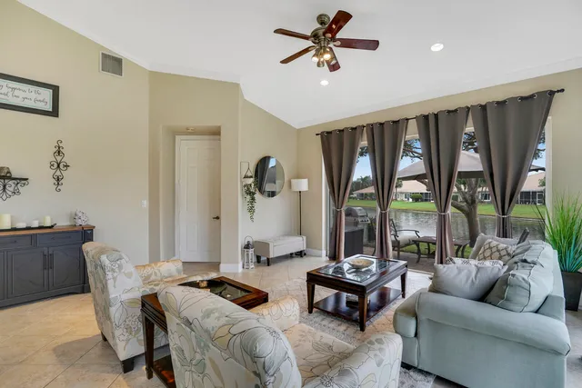 a bathroom with a granite countertop sink a large mirror and a bathtub