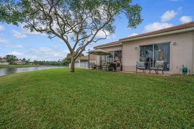 an aerial view of a house with a lake view