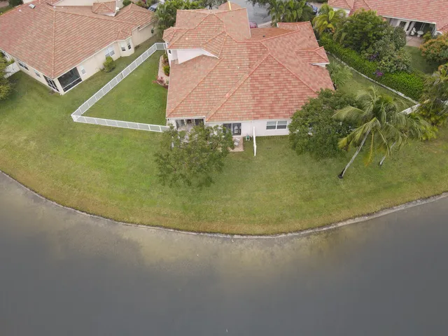 an aerial view of a house with a lake view