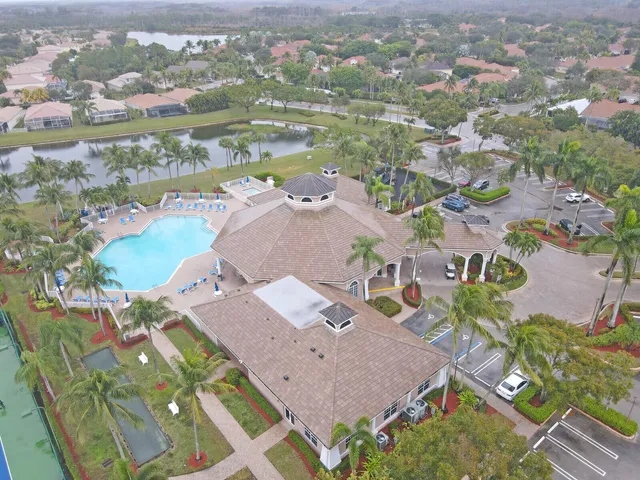 an aerial view of residential houses with outdoor space and pool view