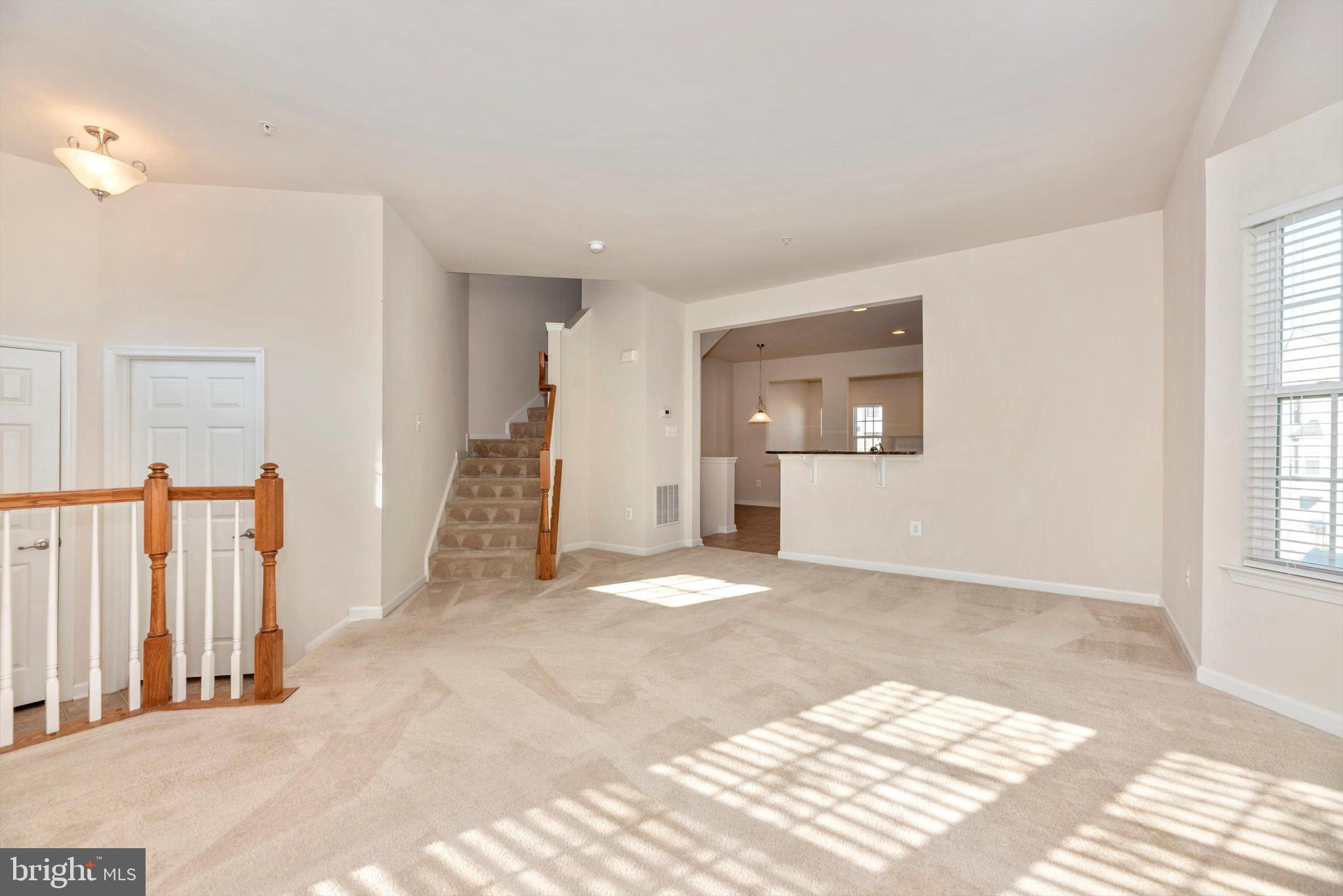 2066 Spring Run Circle Frederick, MD 21702 - Photo 6 of 32 Living Room w/ view of kitchen