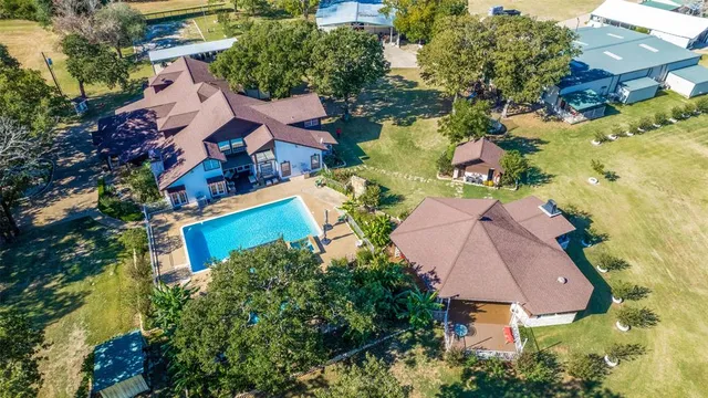 an aerial view of house with yard