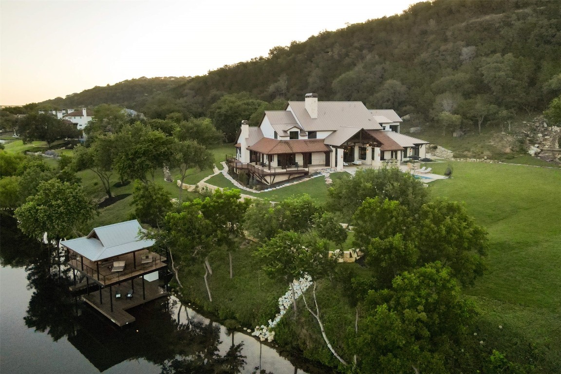 15016 Flat Top Ranch Road Austin, TX 78732 - Photo 15 of 40 an aerial view of a house with a garden