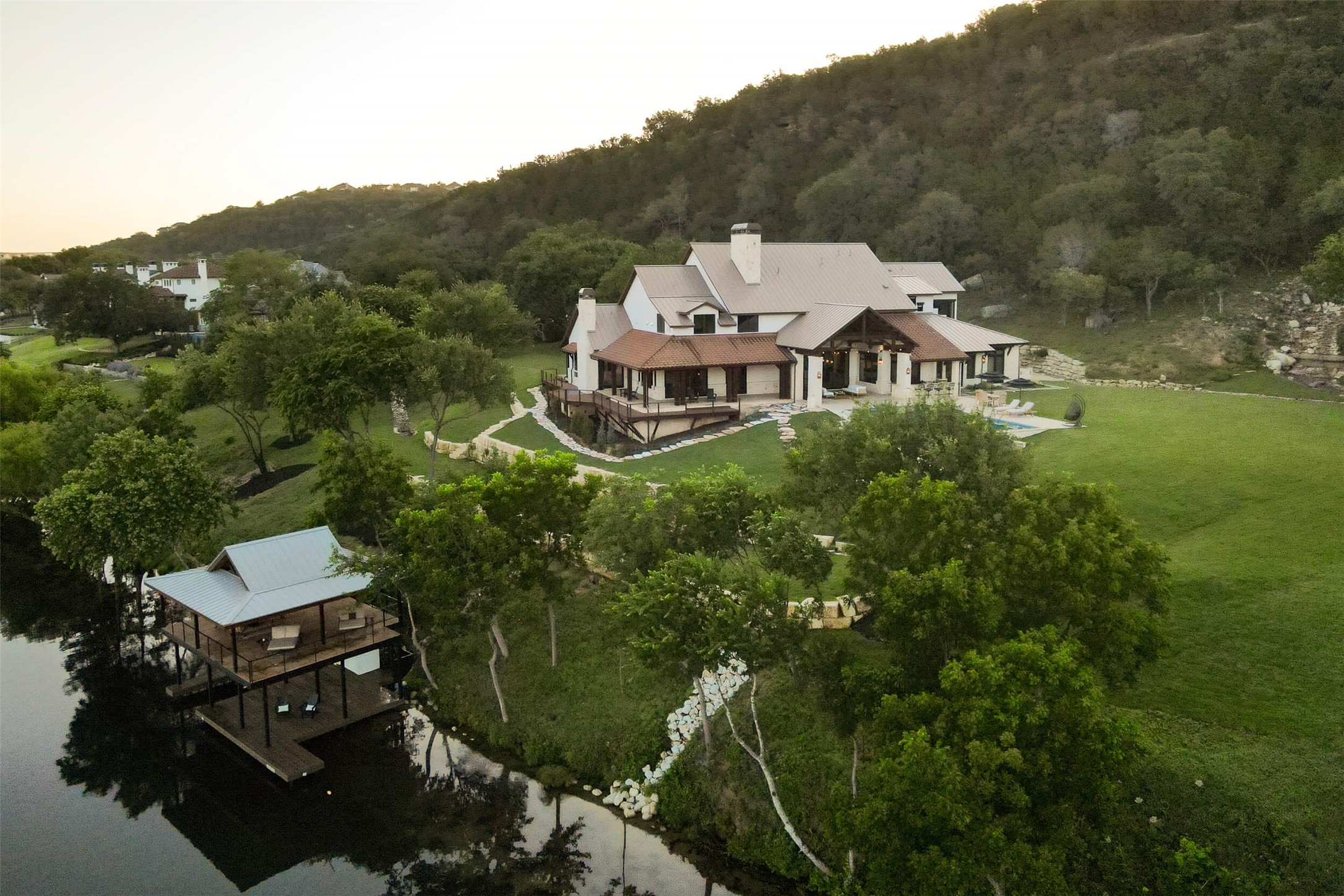 15016 Flat Top Ranch Road Austin, TX 78732 - Photo 15 of 40 an aerial view of a house with a garden