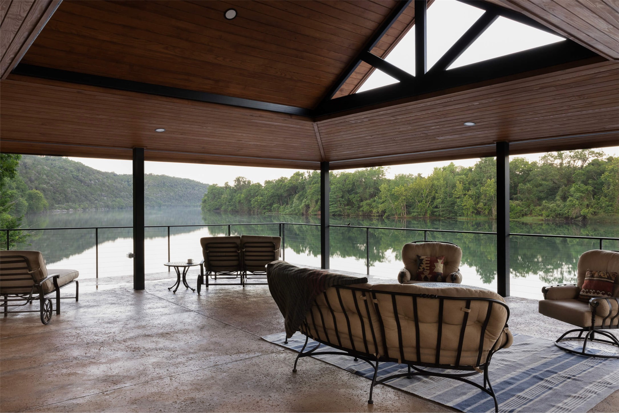 15016 Flat Top Ranch Road Austin, TX 78732 - Photo 19 of 40 a view of a patio with a table chairs and a backyard
