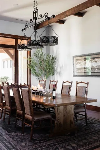 a view of a dining room with furniture window and outside view