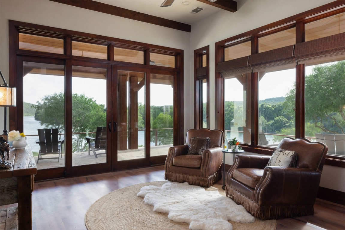 15016 Flat Top Ranch Road Austin, TX 78732 - Photo 30 of 40 a living room with furniture and a large window