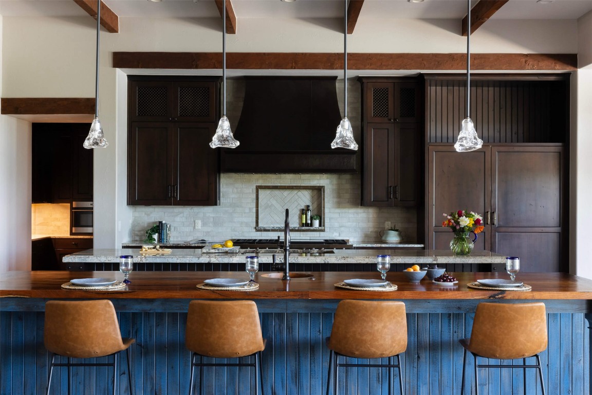 15016 Flat Top Ranch Road Austin, TX 78732 - Photo 3 of 40 a kitchen with stainless steel appliances granite countertop a stove a sink dishwasher and cabinets with wooden floor
