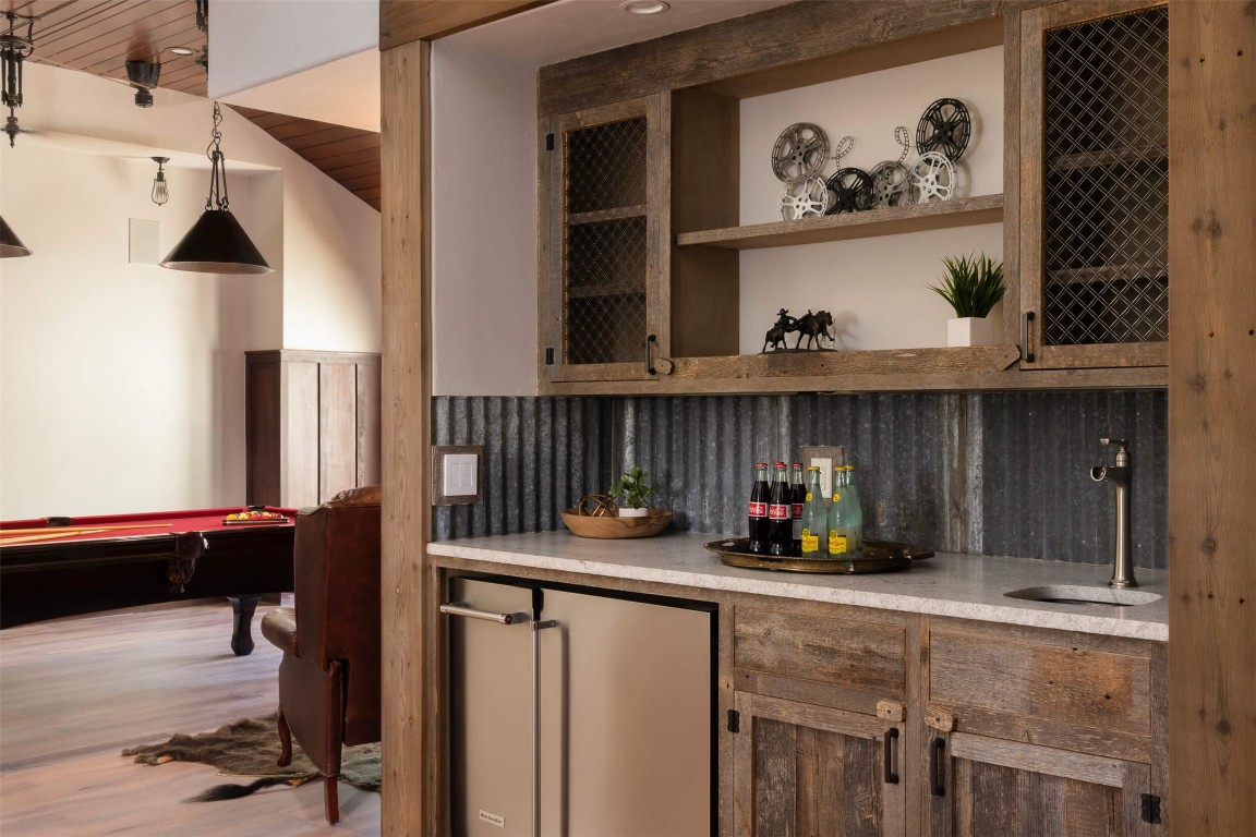 15016 Flat Top Ranch Road Austin, TX 78732 - Photo 35 of 40 a kitchen with a refrigerator and cabinets