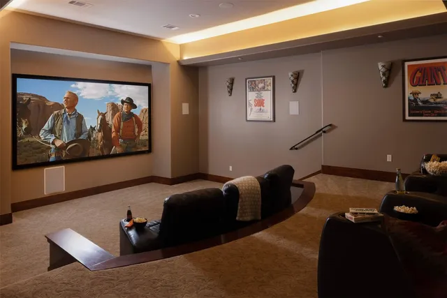 a bedroom with furniture and painting on the wall