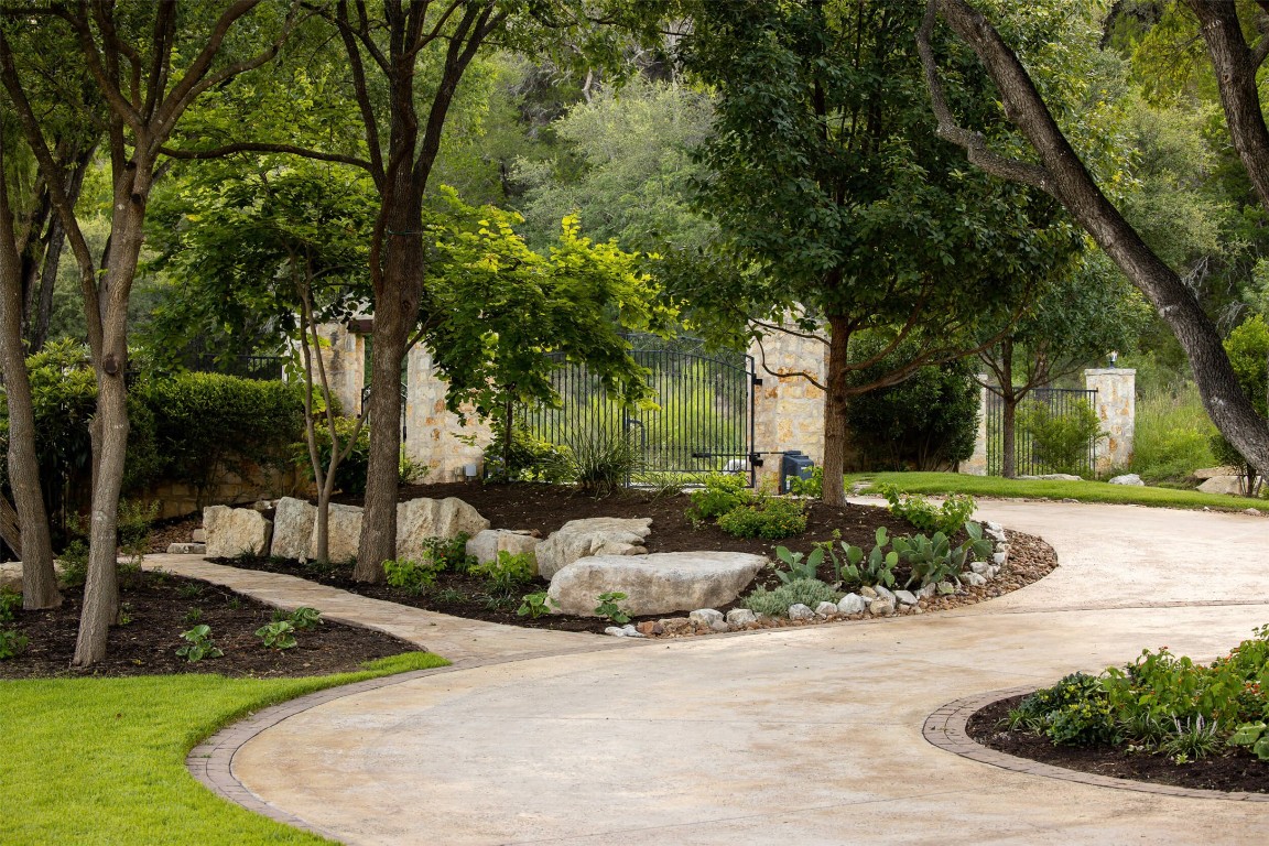 15016 Flat Top Ranch Road Austin, TX 78732 - Photo 40 of 40 a front view of a house with garden