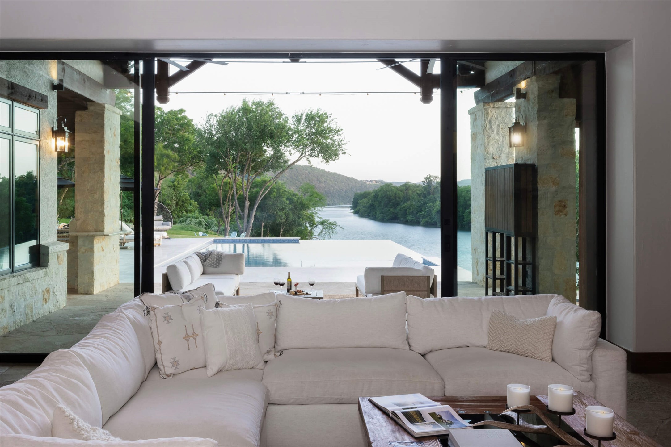 15016 Flat Top Ranch Road Austin, TX 78732 - Photo 5 of 40 a living room with furniture and a floor to ceiling window