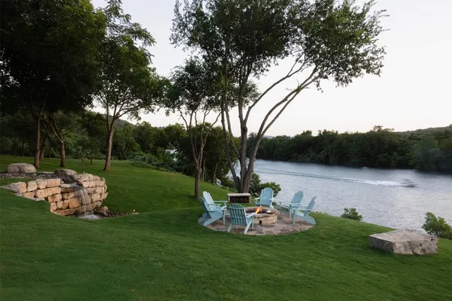a view of a table and chairs in the garden