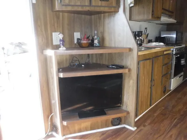a kitchen with a stove and cabinets