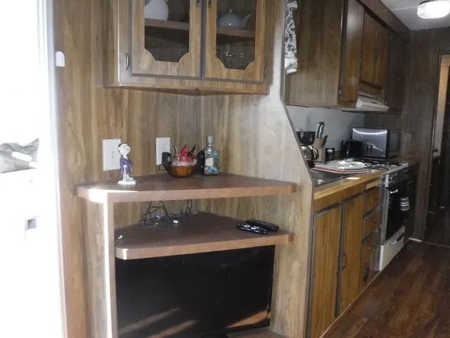 a kitchen with a stove and cabinets
