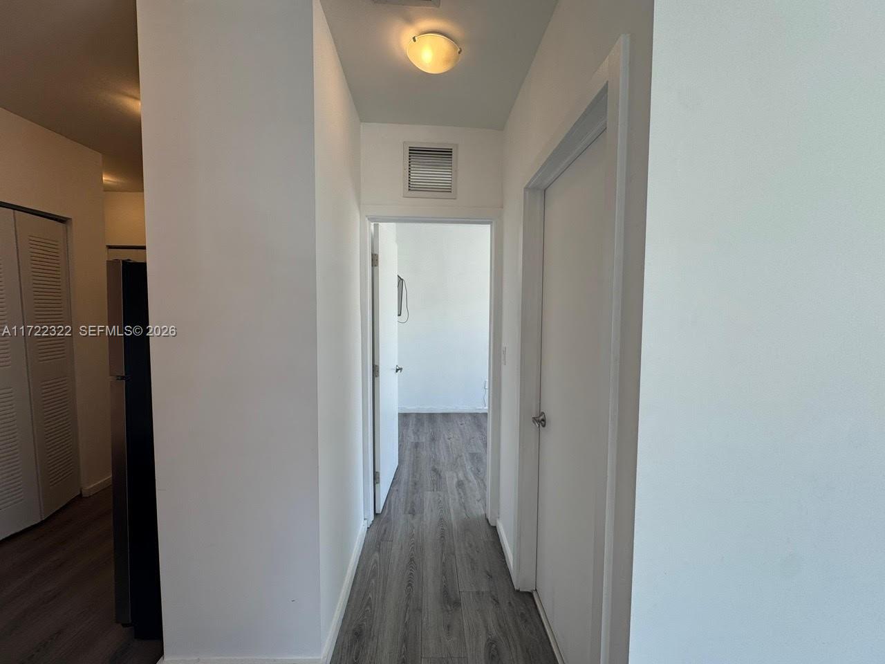 810 7th Street, Unit 207 Miami Beach, FL 33139 - Photo 8 of 16 a view of a hallway with wooden floor