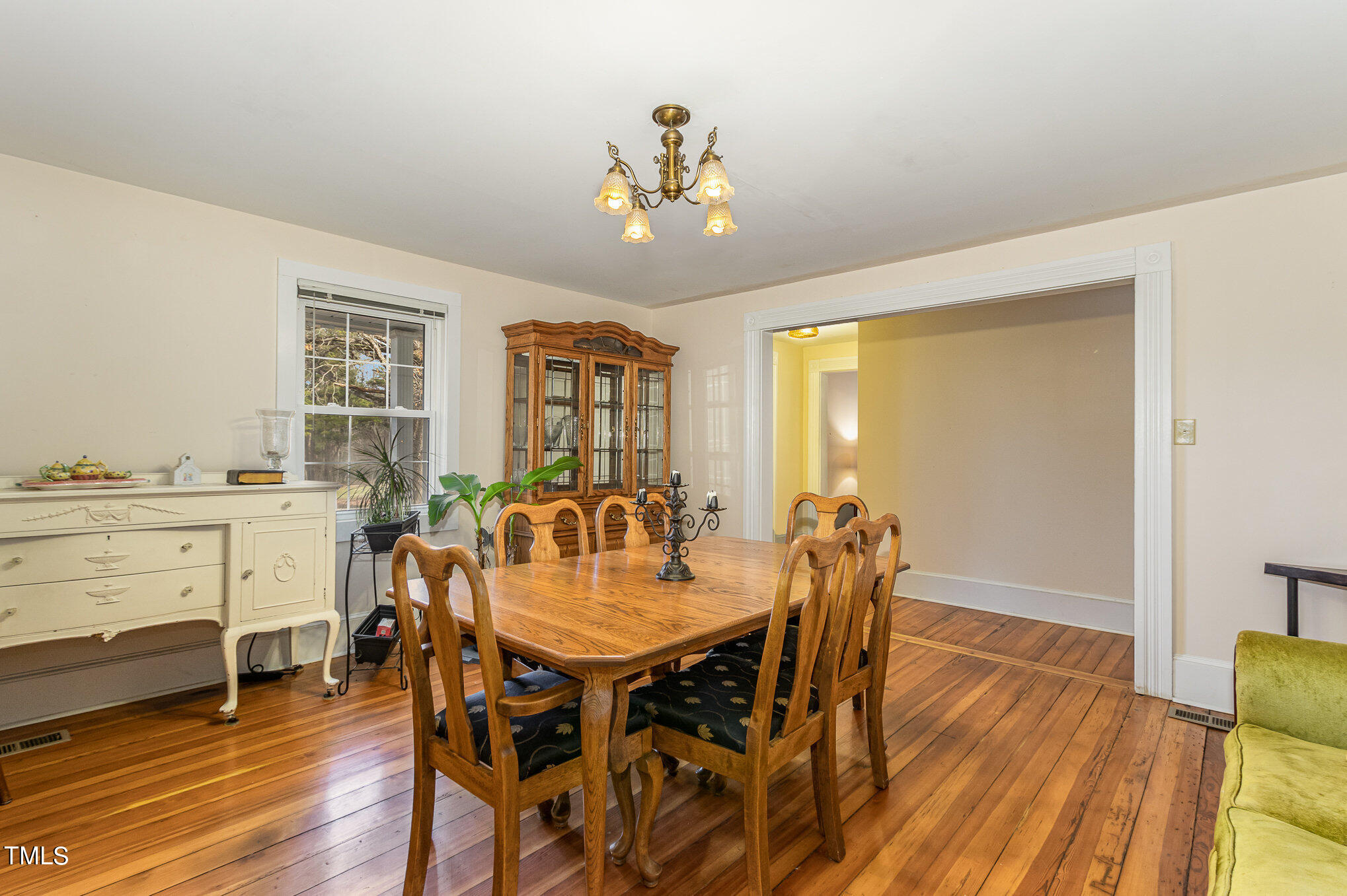 804 Bahama Road Bahama, NC 27503 - Photo 17 of 80 a view of a dining room with furniture and wooden floor
