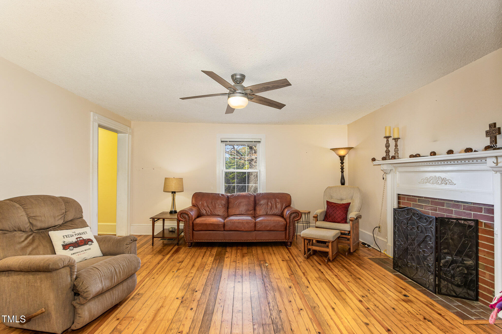 804 Bahama Road Bahama, NC 27503 - Photo 19 of 80 a living room with furniture and a fireplace